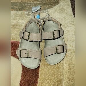 Size 9 toddler's Carter's tan sandals. NWT